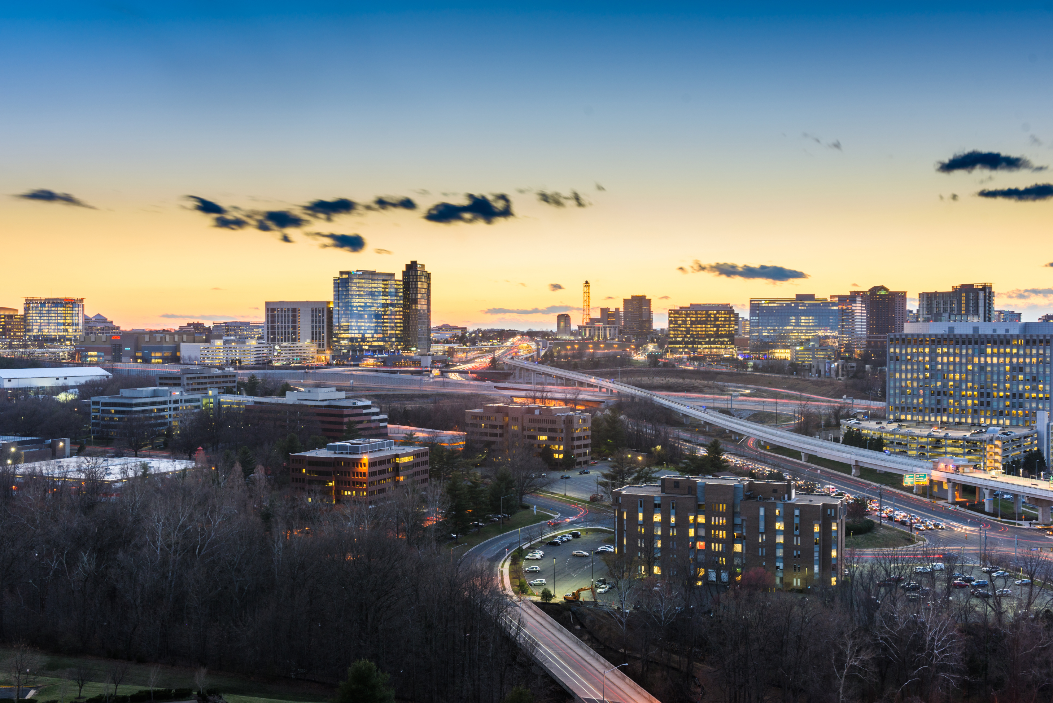a cityscape with a road and buildings