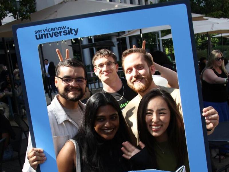 a group of people holding a sign
