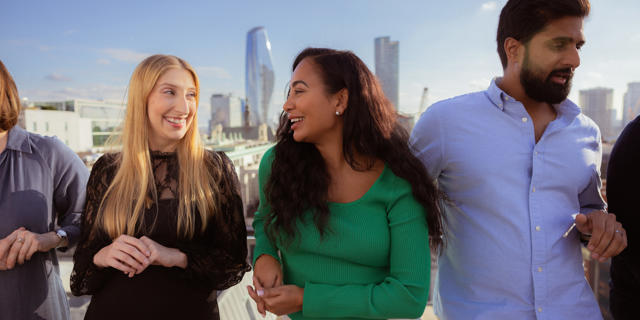 a group of people standing on a rooftop