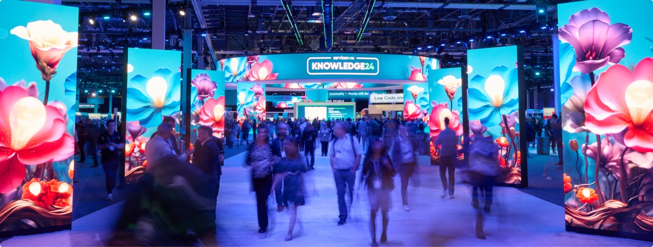 a group of people walking in a large room