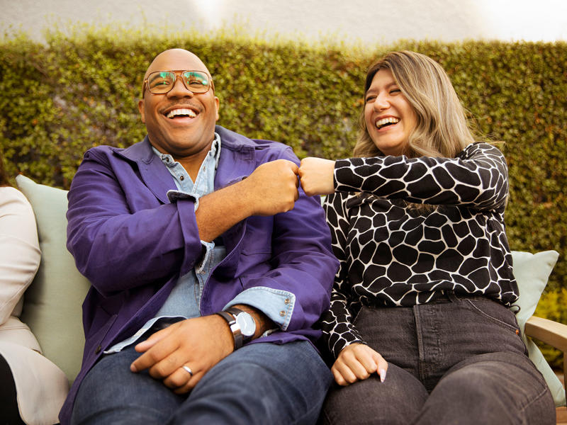 a person and person sitting on a bench