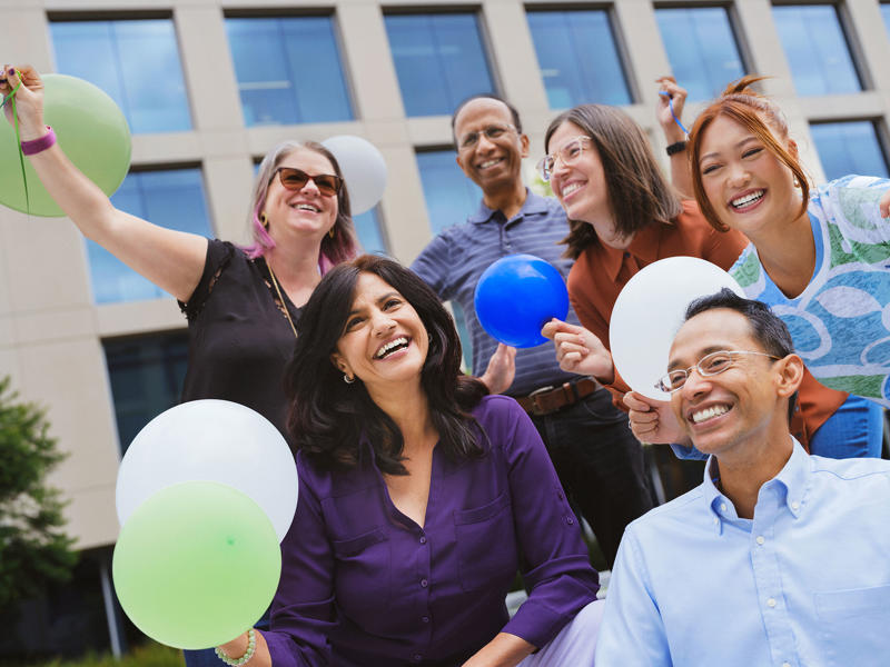 a group of people holding balloons
