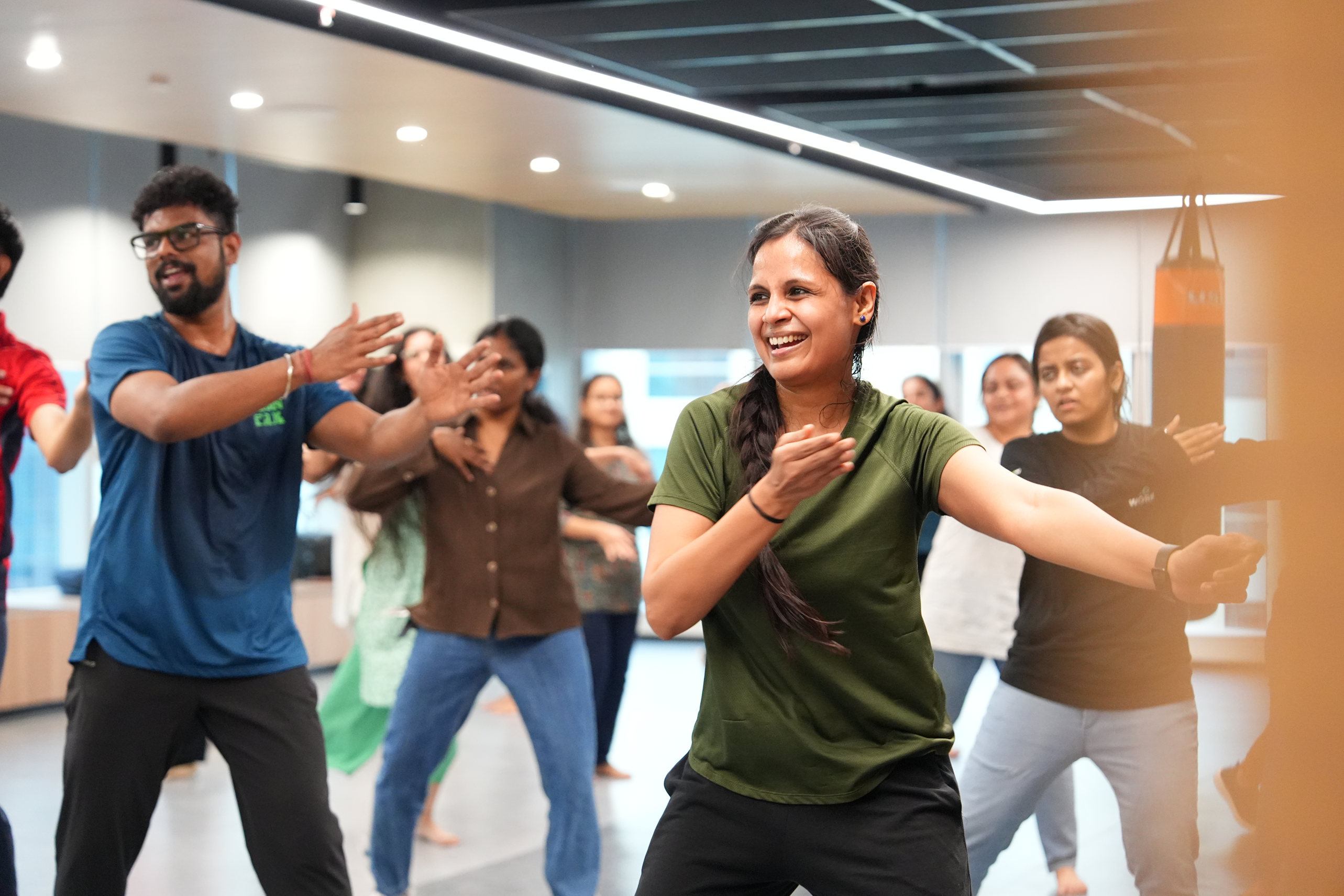 a group of people dancing in a room