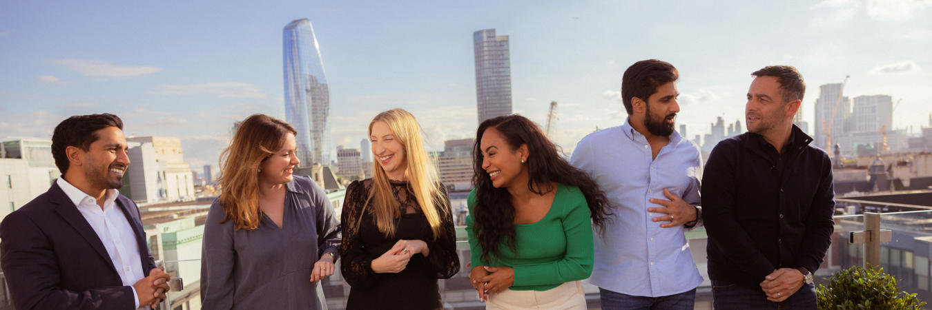 a group of people standing on a balcony