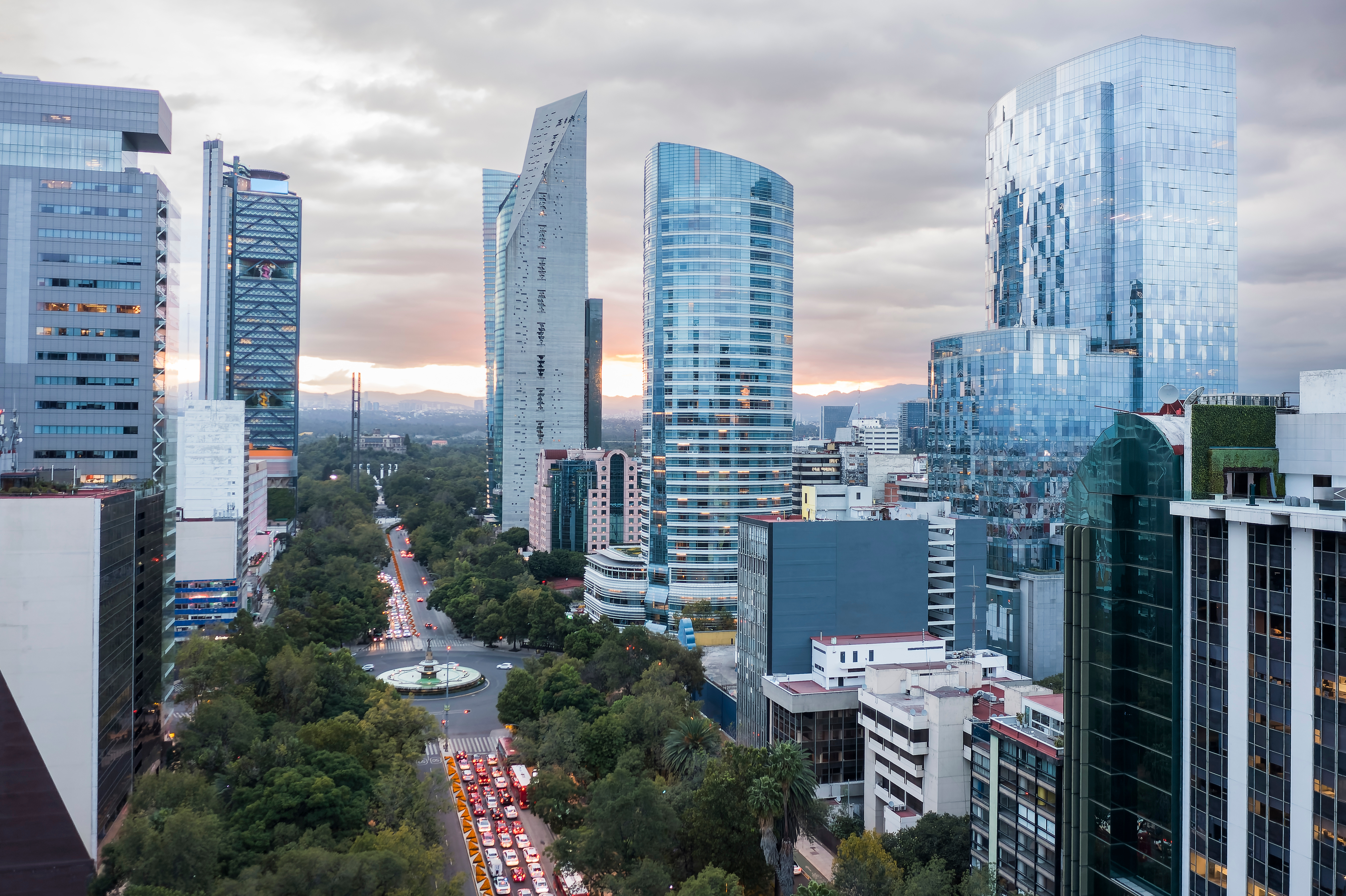 a city with tall buildings and trees