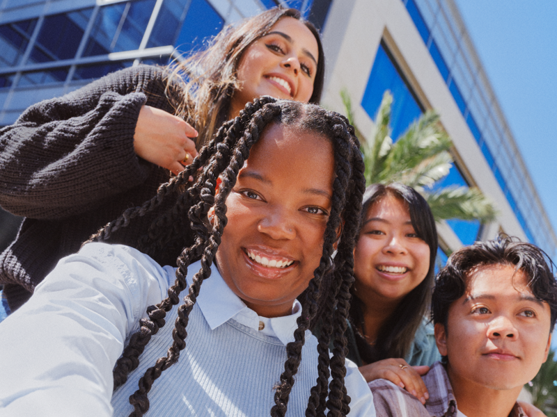 a group of people posing for a selfie