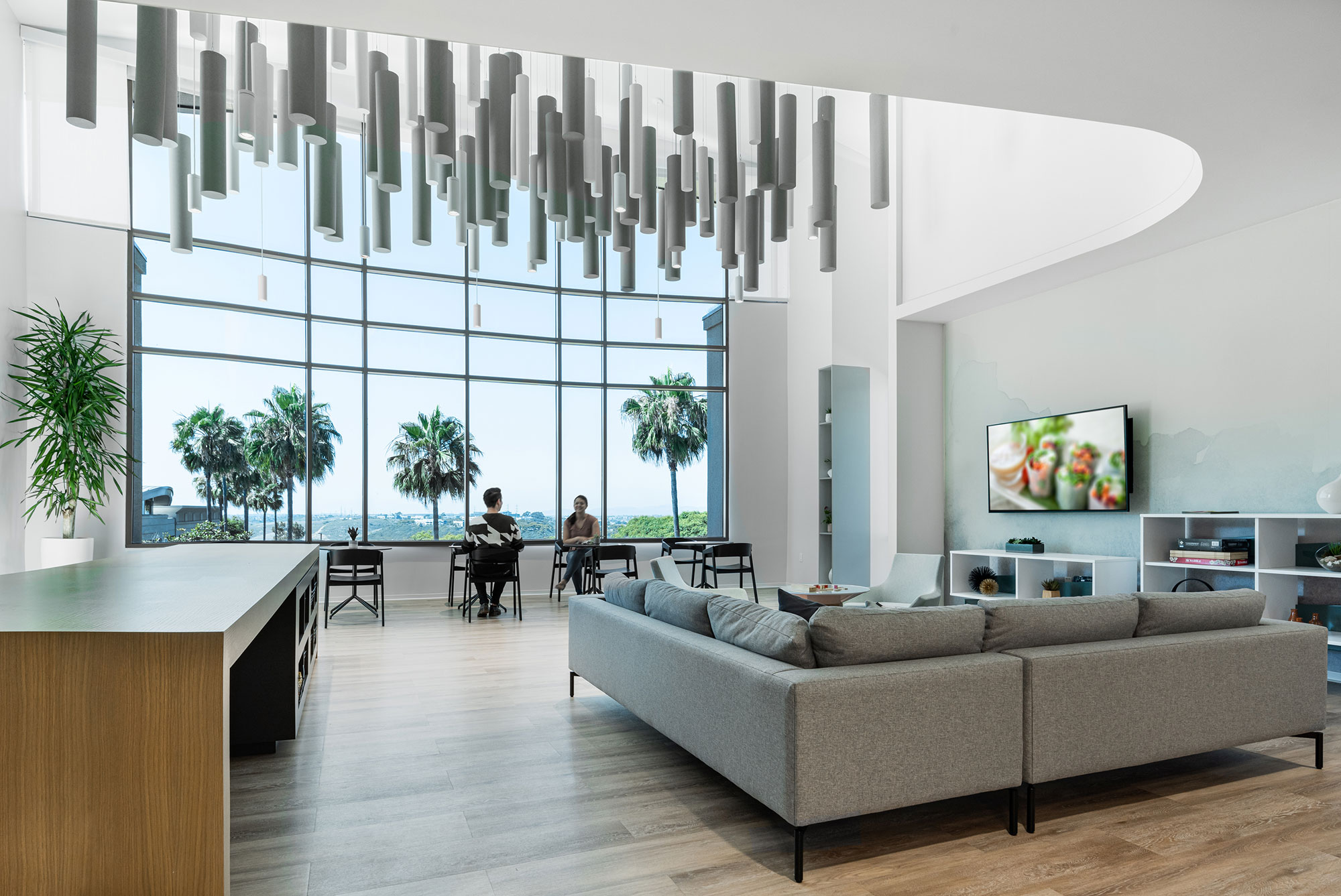 a room with a large window and a large couch