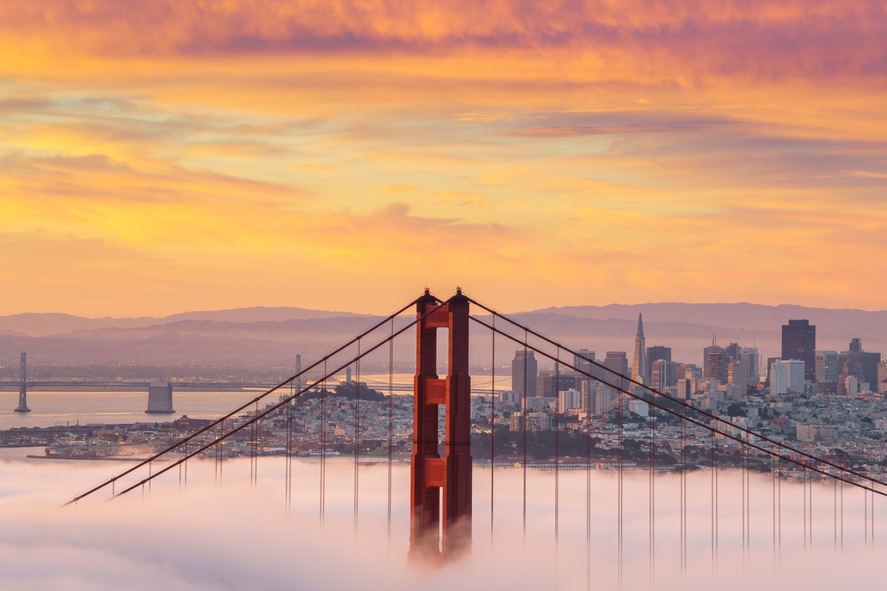 a bridge with clouds in the sky