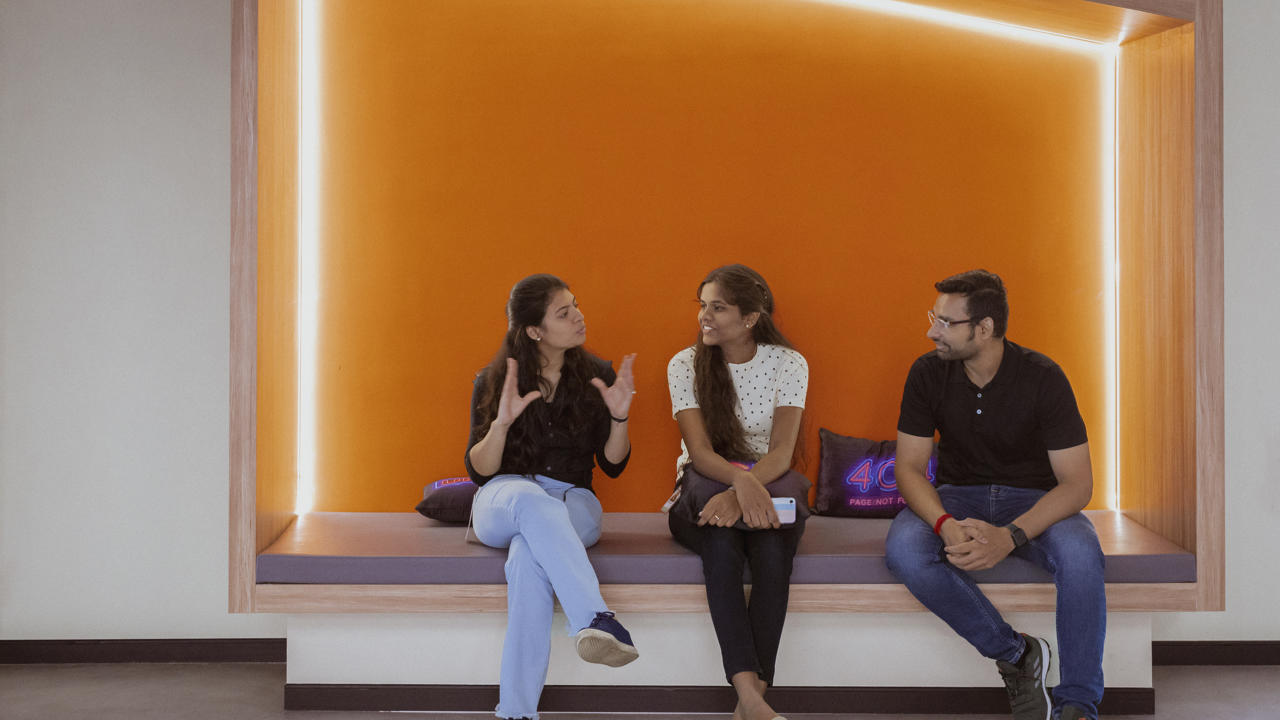 a group of people sitting on a bench