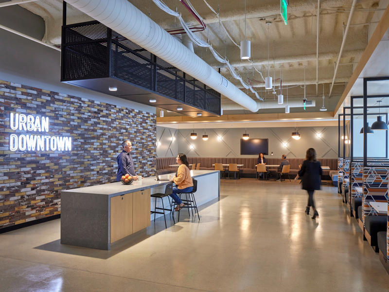 people sitting at a counter in a building